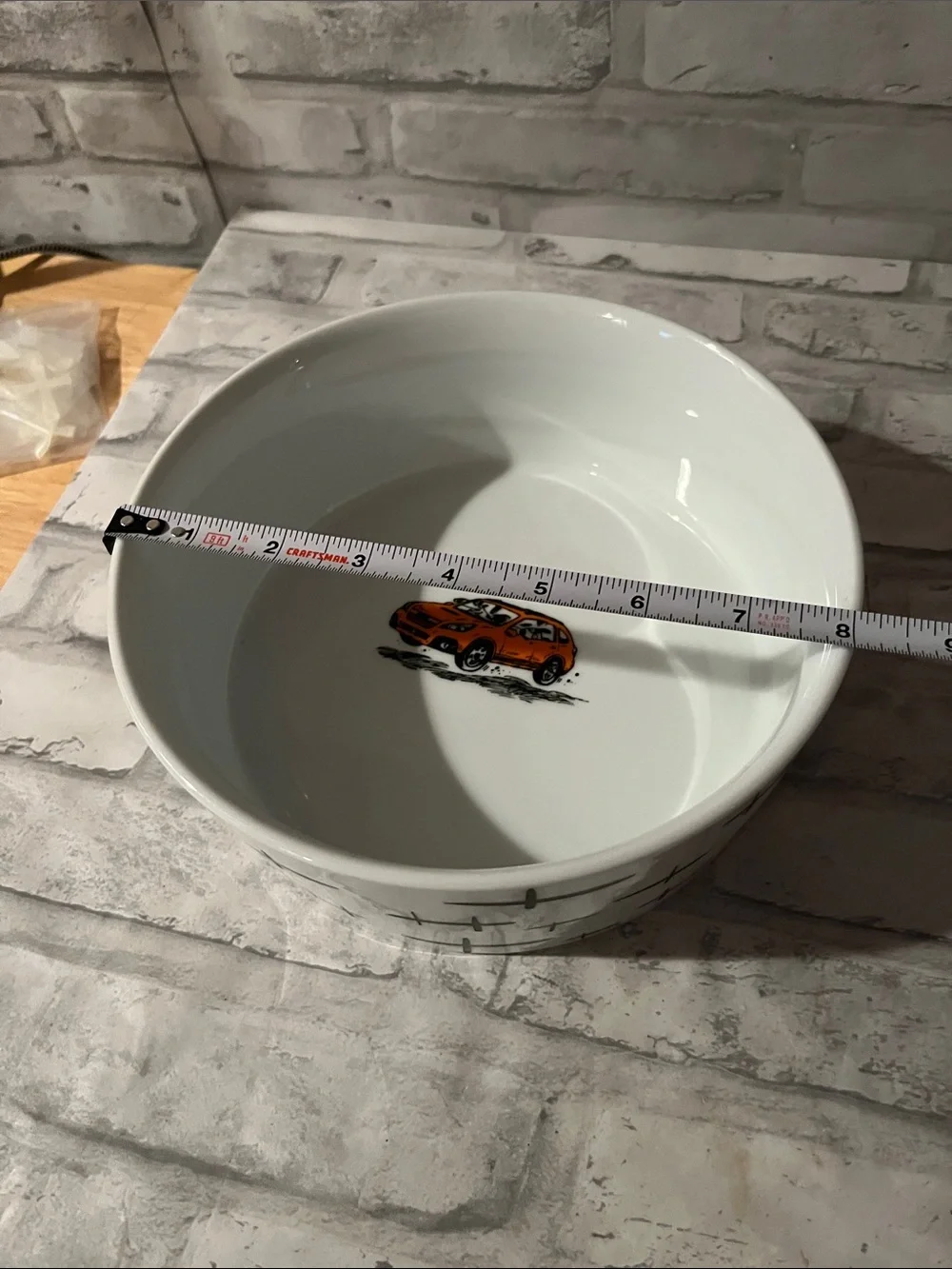 White Ceramic dog dish Bowl with Orange Car Accent and dogs